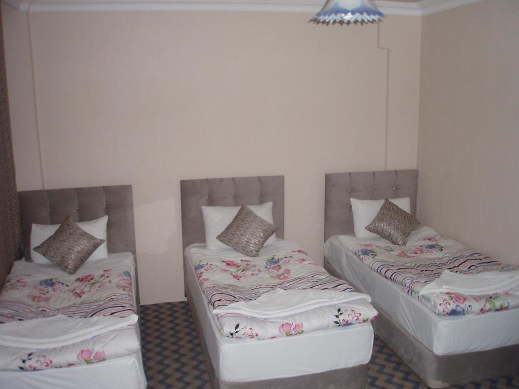 Postel nebo postele na pokoji v ubytování Hotel Pamukkale