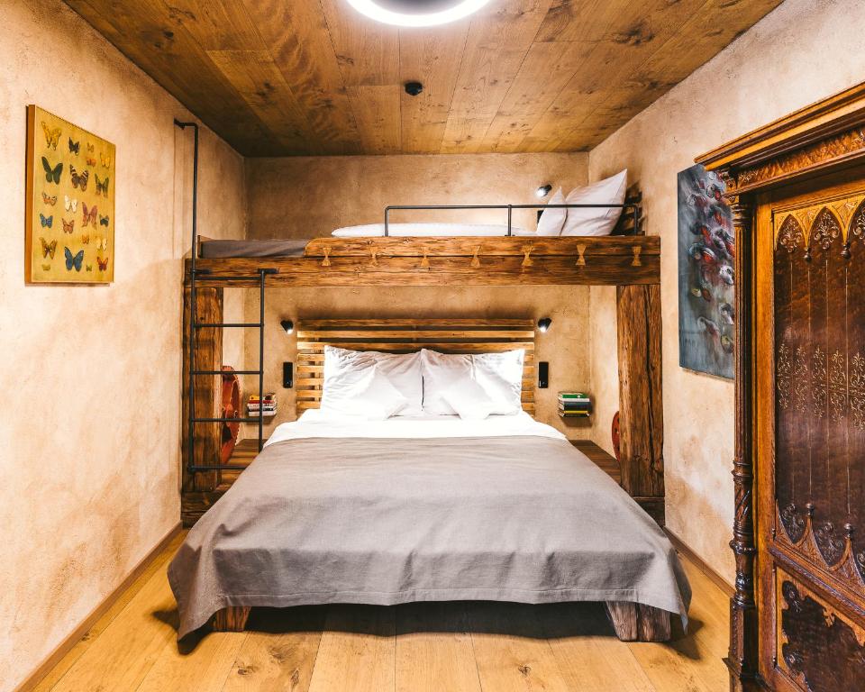 Postel nebo postele na pokoji v ubytování Aparthotel & Wellness Knížecí cesta