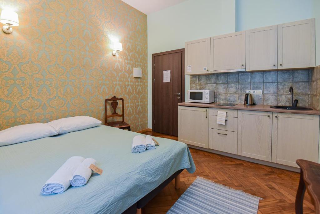 Postel nebo postele na pokoji v ubytování KUBU namai