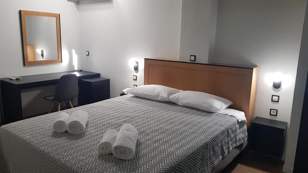 Postel nebo postele na pokoji v ubytování Savoy Hotel