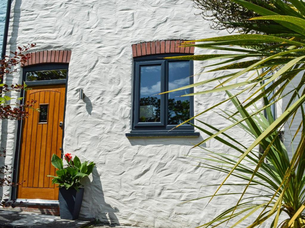 a building with a orange door and a window at 3 The Barn in Haverfordwest