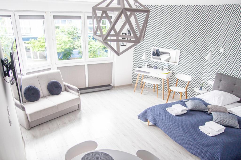 Posteľ alebo postele v izbe v ubytovaní Al-Dom Apartament 112 Awangardia, 300 m do plaży w dzielnicy uzdrowiskowej