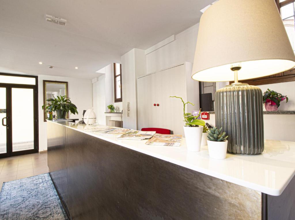 Kuchyň nebo kuchyňský kout v ubytování Hotel Tornielli 9 by LVG Hotel Collection