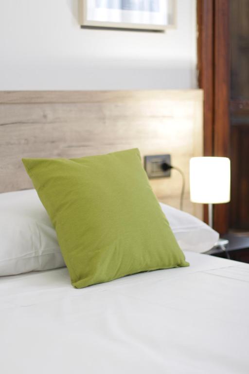 Postel nebo postele na pokoji v ubytování Hotel Tornielli 9 by LVG Hotel Collection