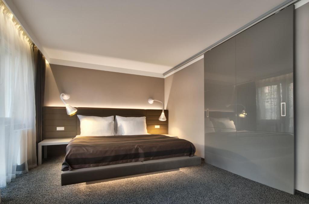 Postel nebo postele na pokoji v ubytování Prezident Luxury Spa & Wellness Hotel