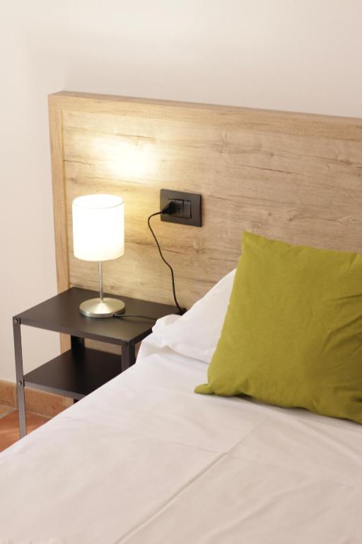 Postel nebo postele na pokoji v ubytování Hotel Tornielli 9 by LVG Hotel Collection
