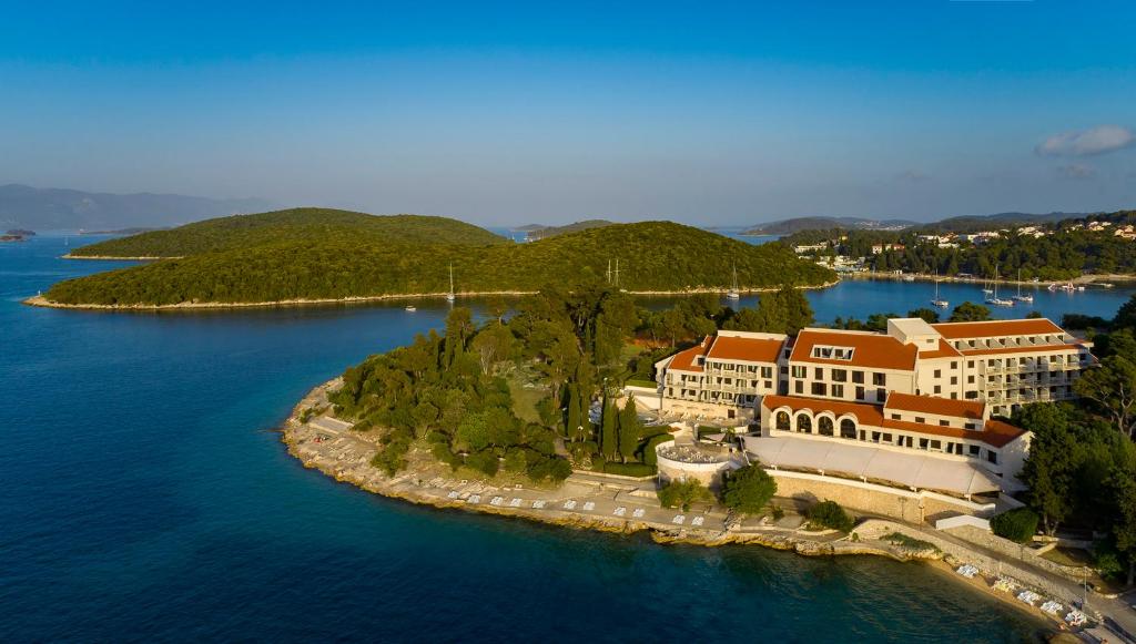 an aerial view of a house on an island in the water at Aminess Liburna Hotel in Korčula