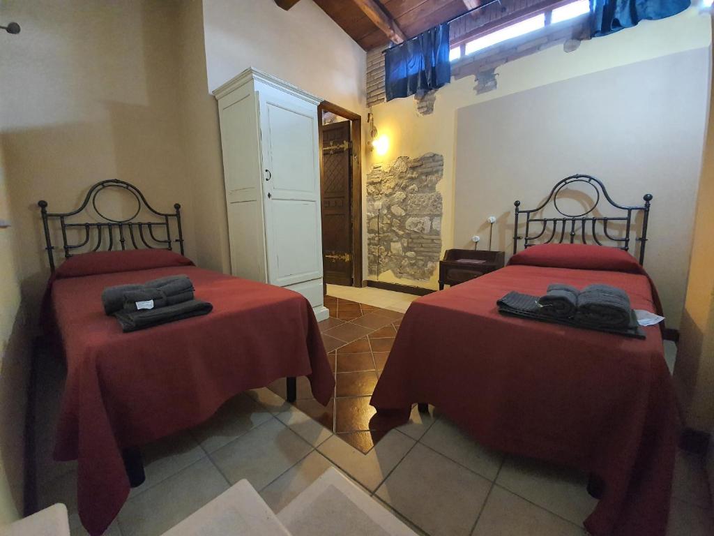 Giường trong phòng chung tại Il Palazzo delle Rondini