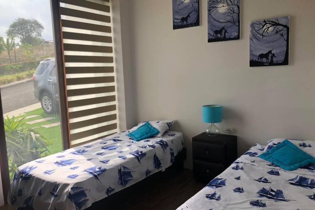 Postel nebo postele na pokoji v ubytování Casa de Playa Koumpí Beach