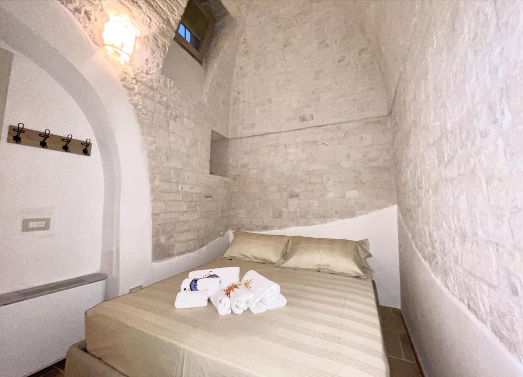Voodi või voodid majutusasutuse Antico Trullo Pasubio toas