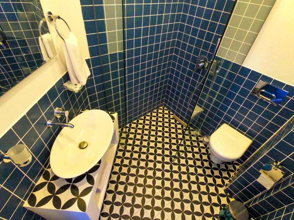 Koupelna v ubytování Pano Hotel