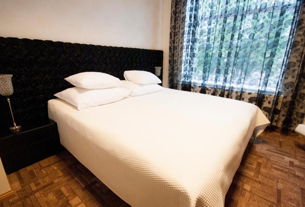 Postel nebo postele na pokoji v ubytování Villa & Restoran Soffa