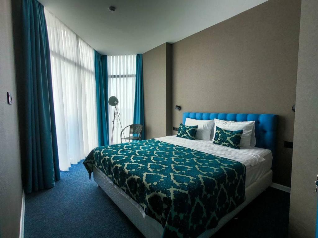 Postel nebo postele na pokoji v ubytování Pano Hotel