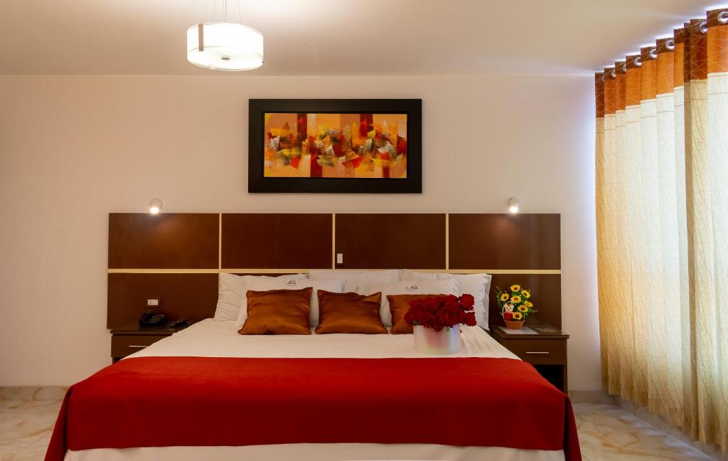 Postel nebo postele na pokoji v ubytování Hotel Royal Inn