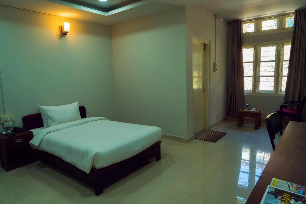 Postel nebo postele na pokoji v ubytování Hotel Ariel