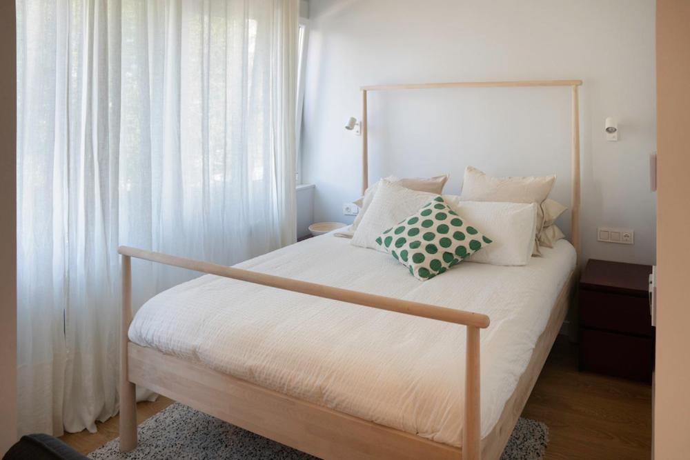 A bed or beds in a room at Zamora Suites Central