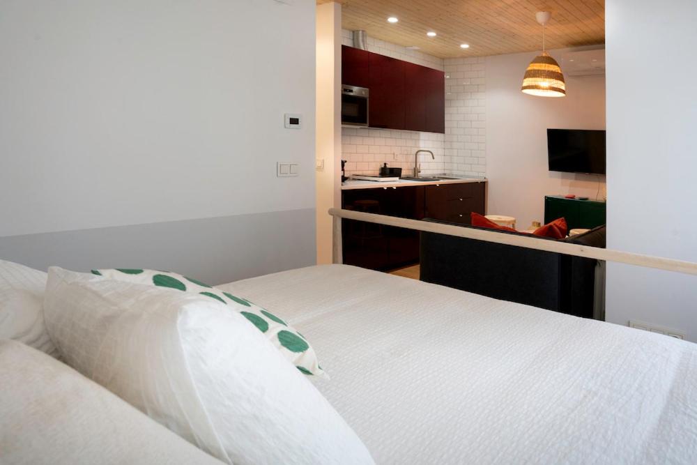 A bed or beds in a room at Zamora Suites Central