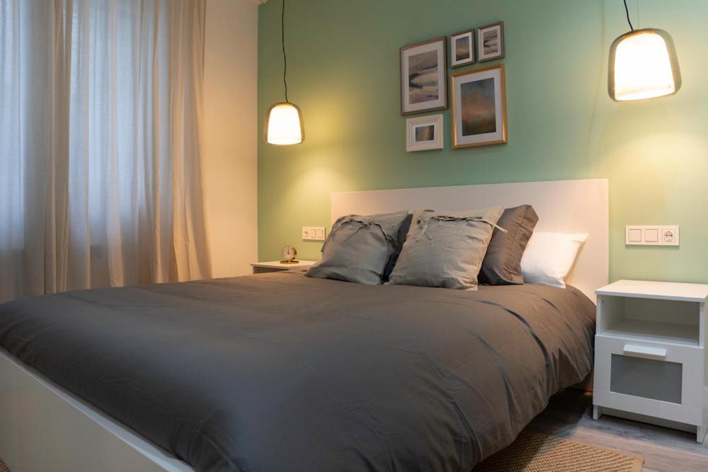 A bed or beds in a room at Zamora Suites Central