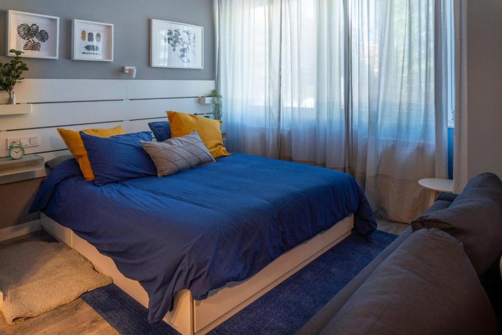 A bed or beds in a room at Zamora Suites Central