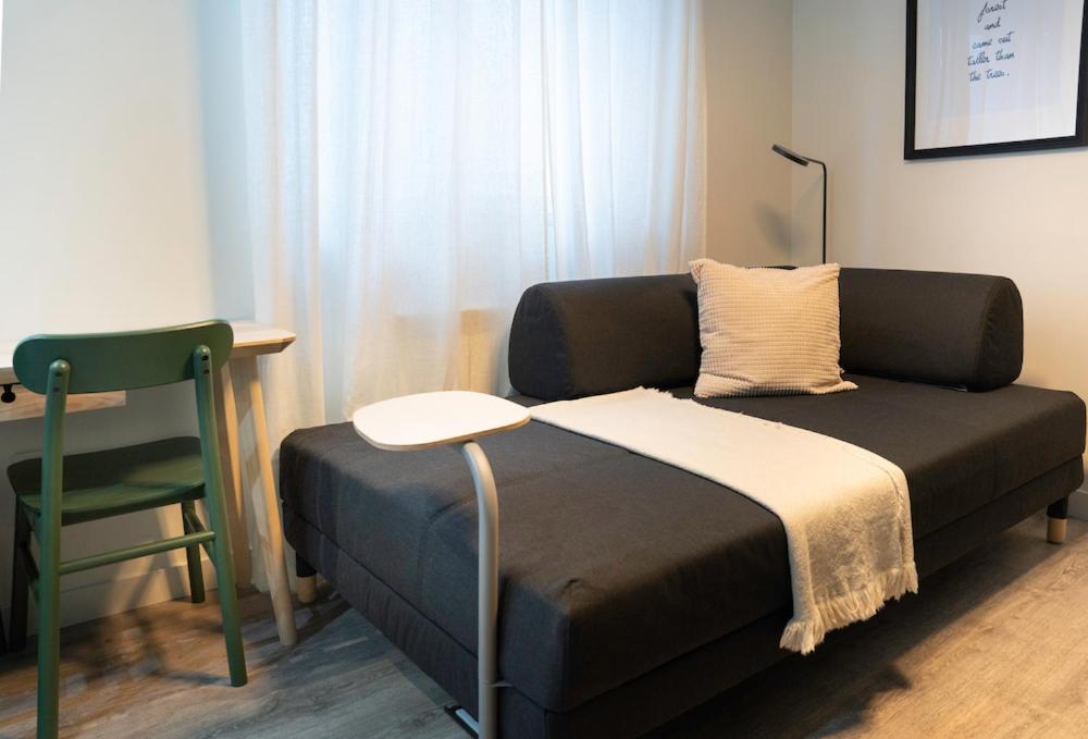 A bed or beds in a room at Zamora Suites Central