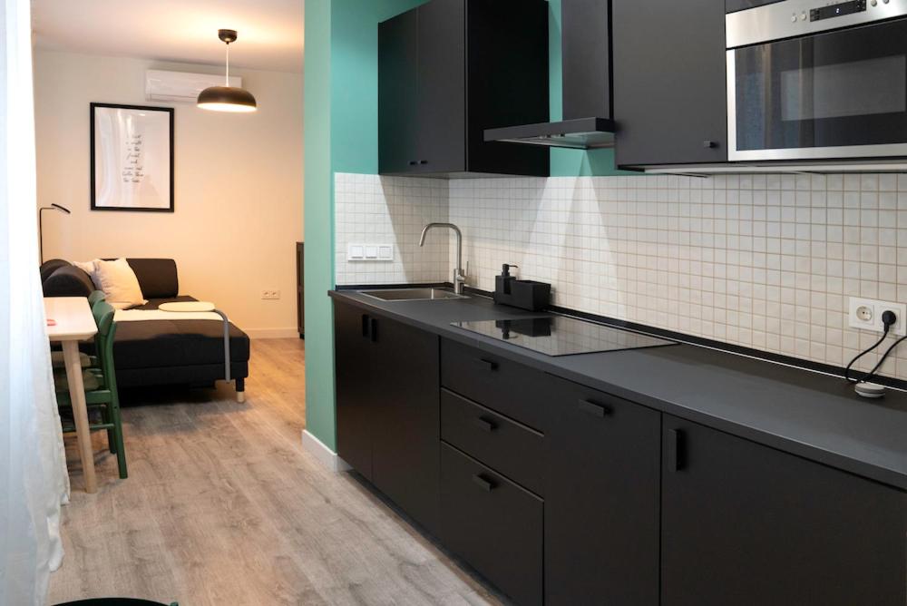 A kitchen or kitchenette at Zamora Suites Central