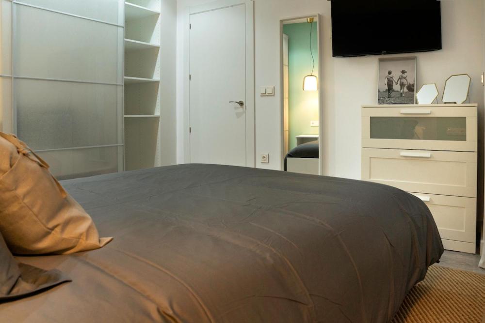 A bed or beds in a room at Zamora Suites Central