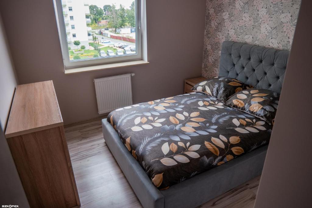 Ένα ή περισσότερα κρεβάτια σε δωμάτιο στο Łąkowa 3