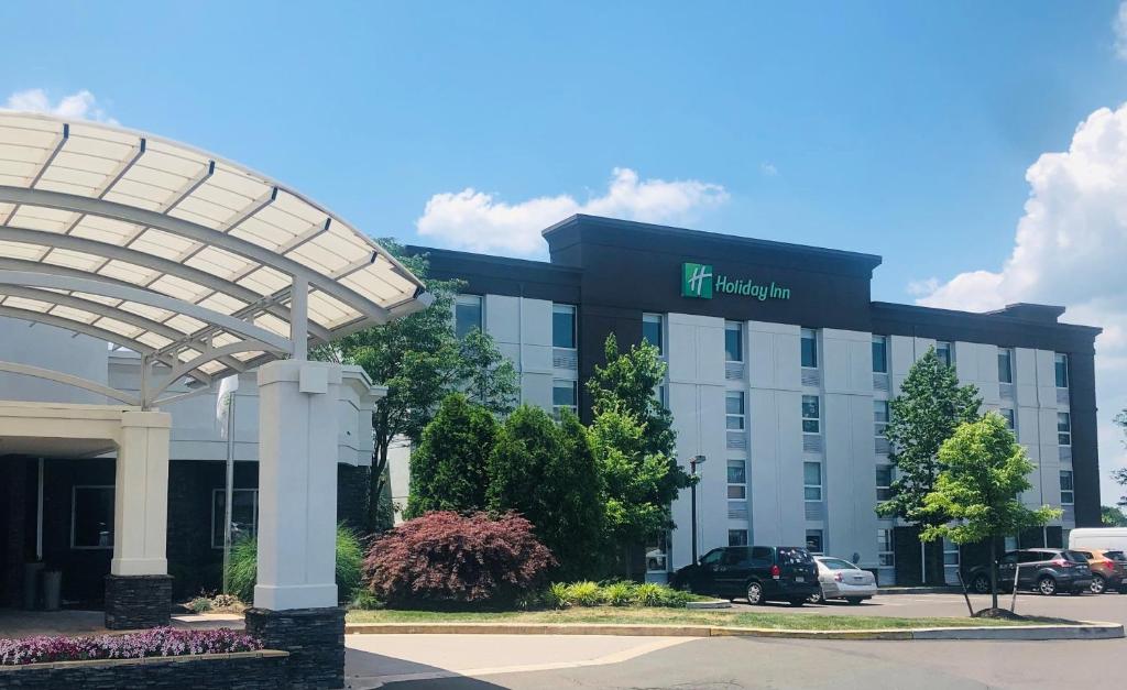 a hotel building with a sign on the front of it at Holiday Inn Lansdale-Hatfield, an IHG Hotel in Kulpsville