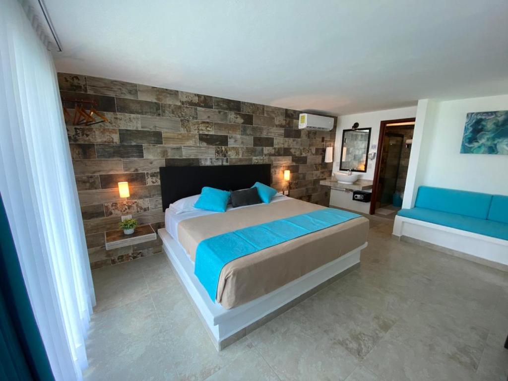 Postel nebo postele na pokoji v ubytování Hotel Aldea 19 Bacalar