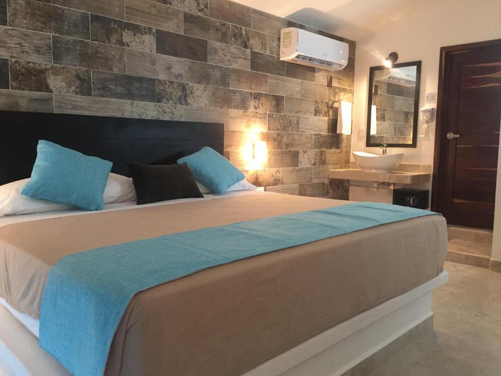 Postel nebo postele na pokoji v ubytování Hotel Aldea 19 Bacalar