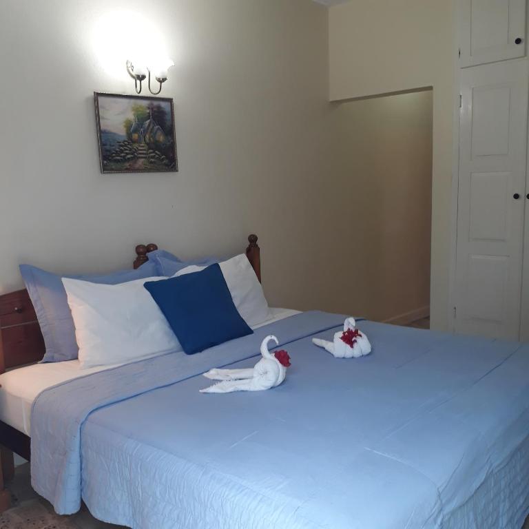 Postel nebo postele na pokoji v ubytování Paradise Inn