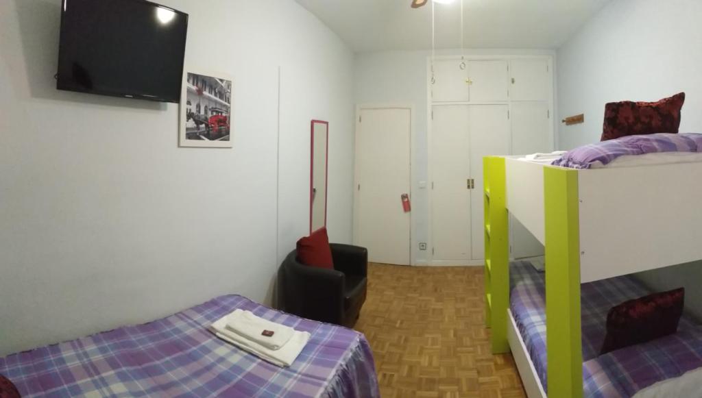 Postel nebo postele na pokoji v ubytování Pensión Pamplonabeds