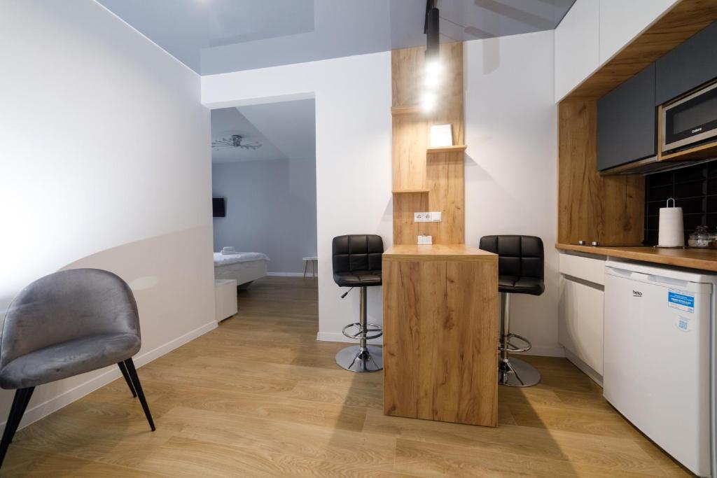 Kuchyň nebo kuchyňský kout v ubytování Residente Centr Apart-Hotel