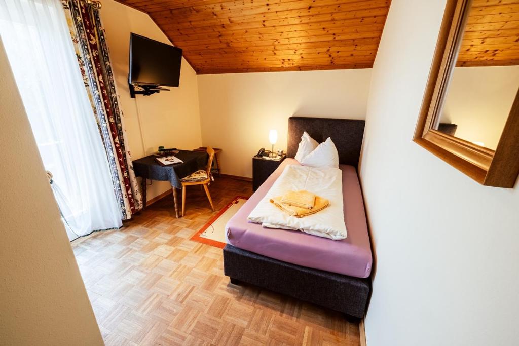 Postel nebo postele na pokoji v ubytování Landgasthof Zum Hammerschmied