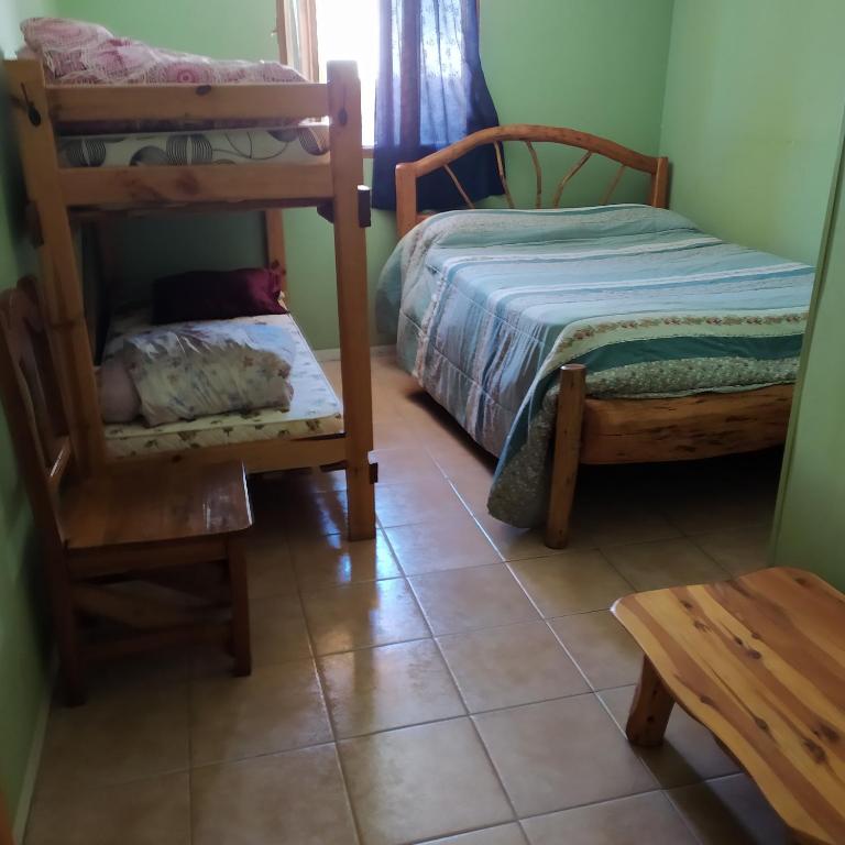Postel nebo postele na pokoji v ubytování Ankatu Hostel