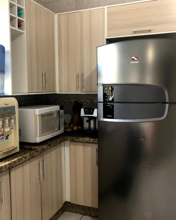 Kuchyň nebo kuchyňský kout v ubytování Quarto Privado em residência no Coração de Foz - casa e banheiro compartilhado