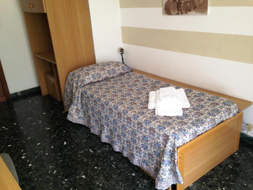 Postel nebo postele na pokoji v ubytování Albergo La Neigra
