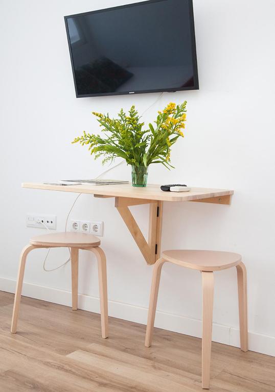 A television and/or entertainment centre at GoToSeville Molviedro Apartments