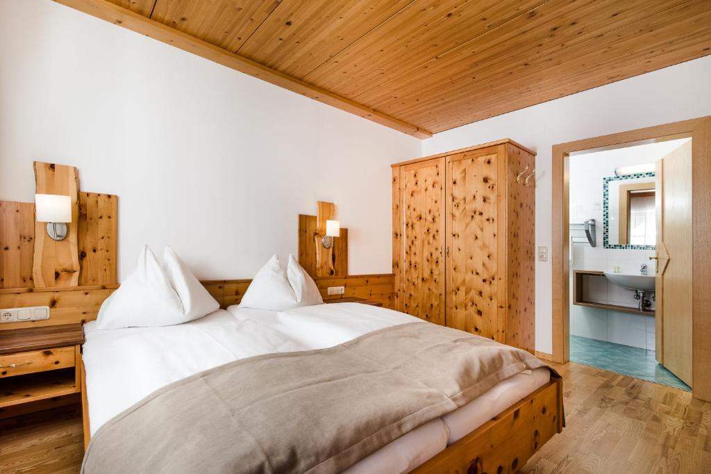 Postel nebo postele na pokoji v ubytování Hotel Langeck