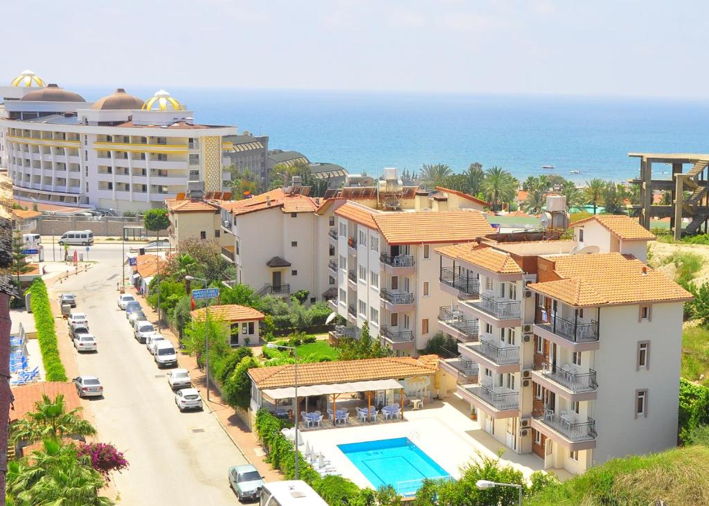 an aerial view of a city with buildings and the ocean at Kaya Apart Hotel Side in Side