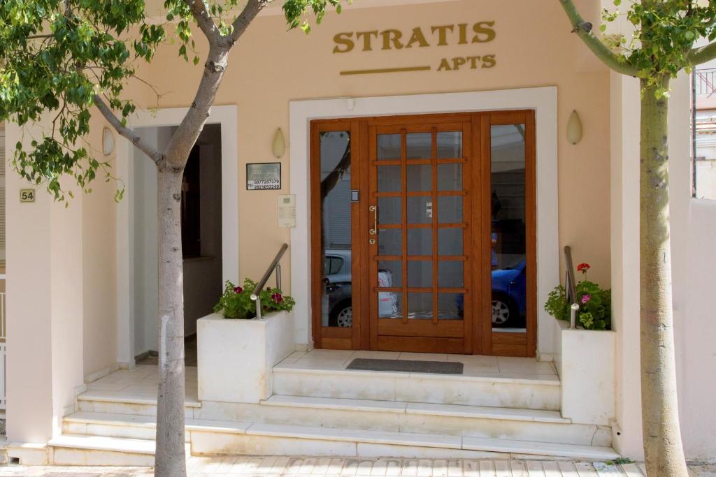 a entrance to a building with a wooden door at Stratis Apartments in Chania Town