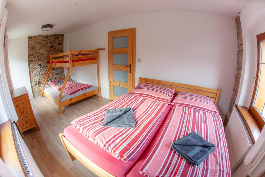 Postel nebo postele na pokoji v ubytování Apartman Vejminek