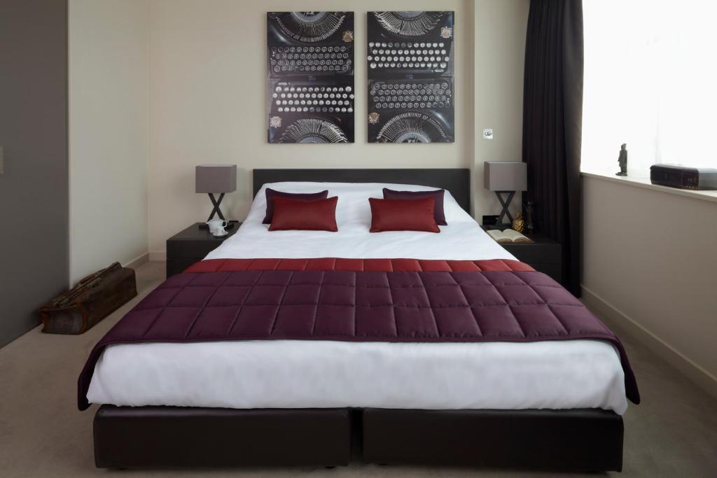 Postel nebo postele na pokoji v ubytování Hotel Xanadu