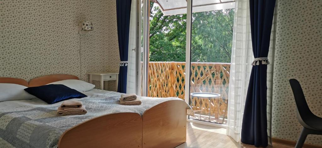 Postel nebo postele na pokoji v ubytování Green Gile Villa in Druskininkai Center