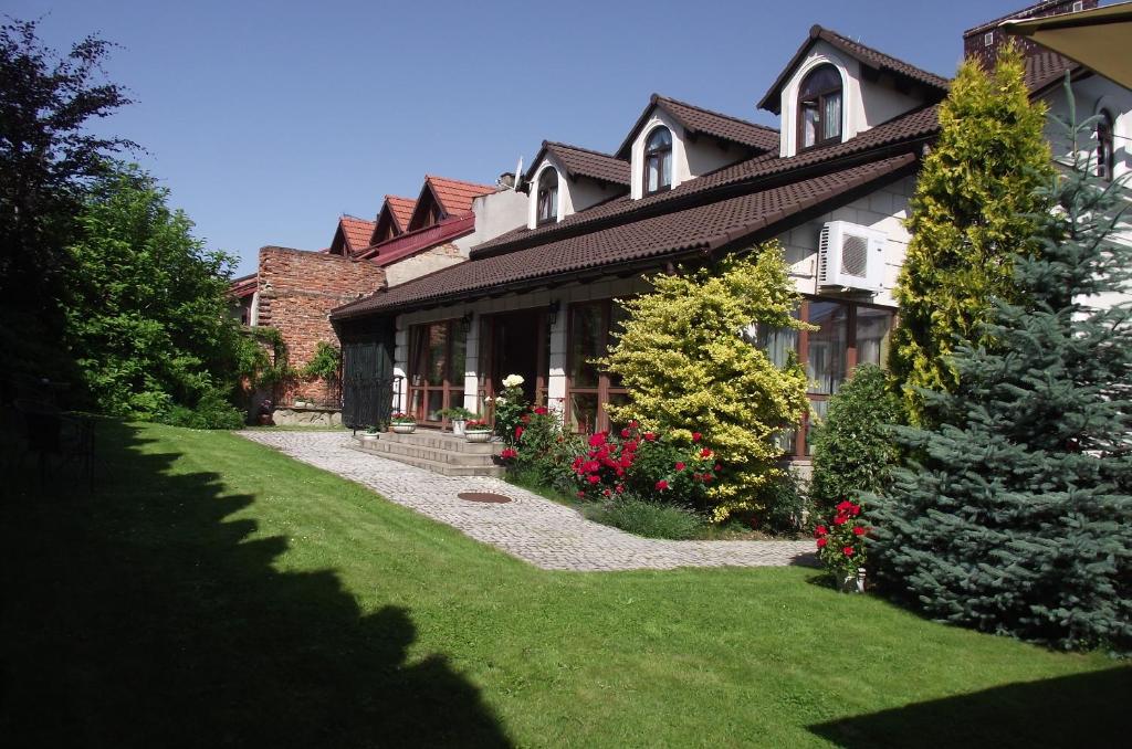 a large house with a lawn in front of it at Villa Del Arte Bed & Breakfast in Wadowice