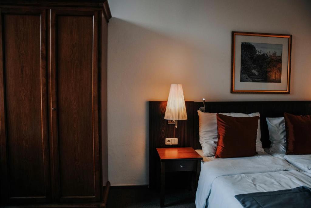 Łóżko lub łóżka w pokoju w obiekcie B&B Hotel Praha