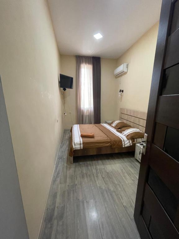 Postel nebo postele na pokoji v ubytování Fazis Hotel