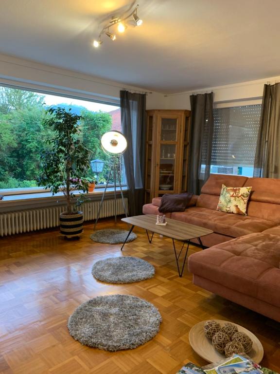a living room with a couch and a table at Ferienwohnung Das Inge De Unterne in Bernau am Chiemsee