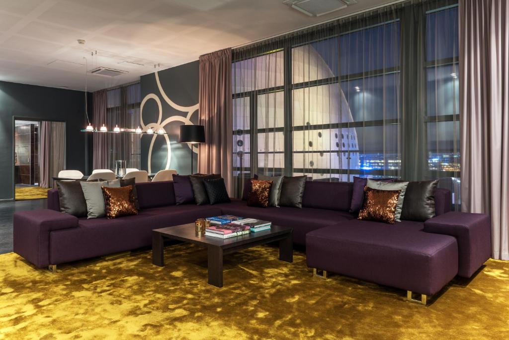 a living room filled with furniture and a couch at Quality Hotel Globe in Stockholm