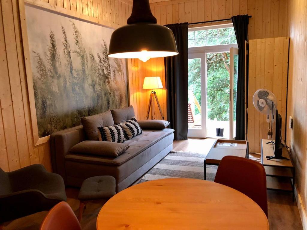 Posezení v ubytování Apartamenty Leśna Przystań